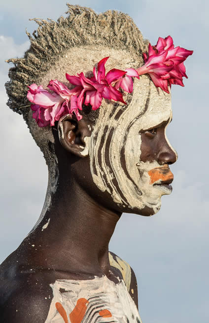 Carol Beckwith & Angela Fisher, Kara Painted Boy with Flowers, Omo River