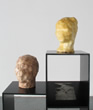 Melissa Bugarella, Heads, 2012, clay & resin, dimensions variable